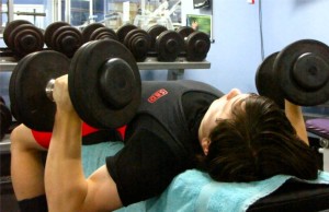 Teenager doing a Dumbbell Bench Press